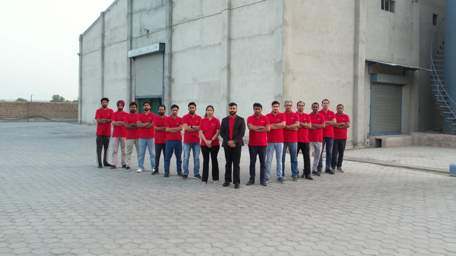 The Kasturi team in red shirts outside the Sri Ganganagar factory